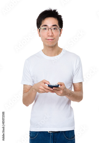 Young man use of mobile phone © leungchopan