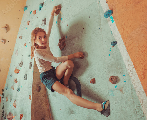 Free climber little girl training indoor