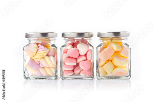Colorful candies isolated on white photo