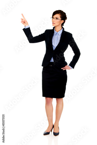 Businesswoman pointing up.