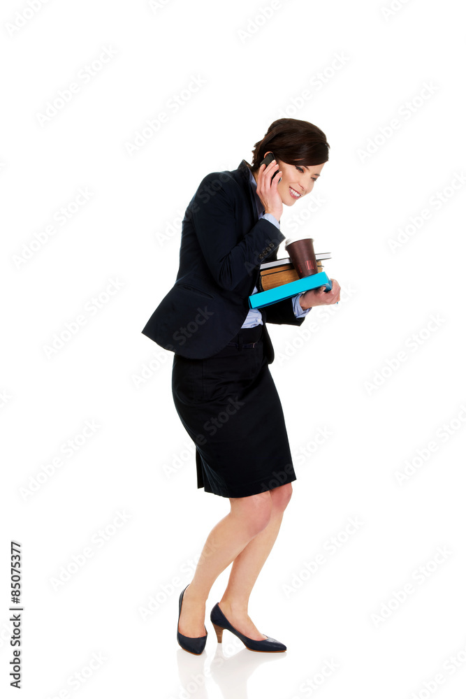 Hurry businesswoman talking on the phone. Hurry businesswoman talking on the phone.