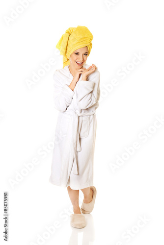 Young smiling woman in bathrobe