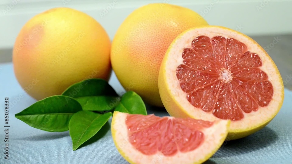 Ripe grapefruit close-up on wooden table background. Ripe grapefruit close-up on wooden table background.