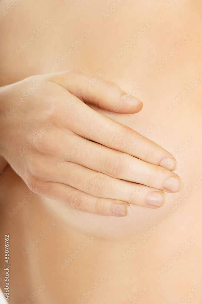 Topless woman touching her breast Topless woman touching her breast