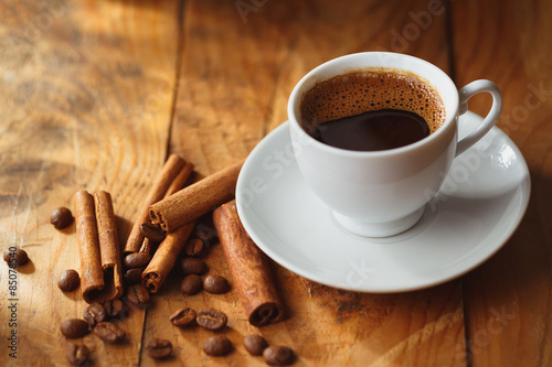 Cup of black coffee on wooden table