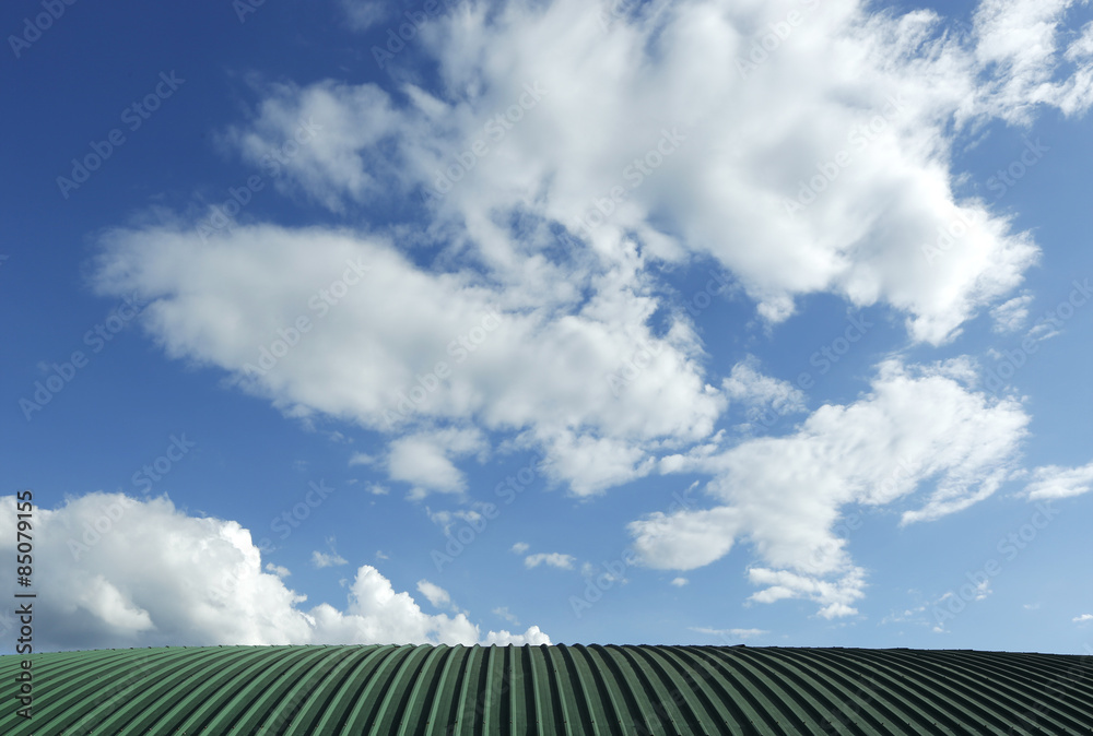 Blue sky over Green Metal sheet roof Blue sky over Green Metal sheet roof