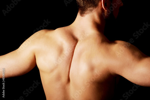 Sexy muscular man showing his muscular back.