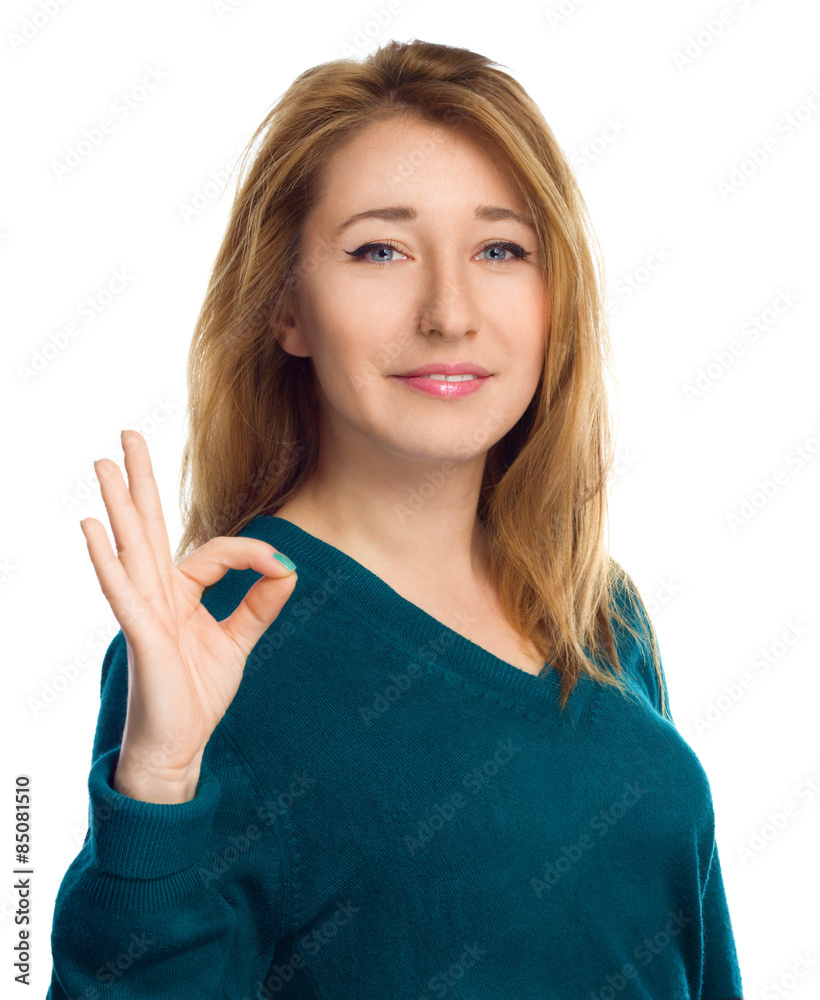 Young woman is showing OK sign, isolated over white. Young woman is showing OK sign, isolated over white.