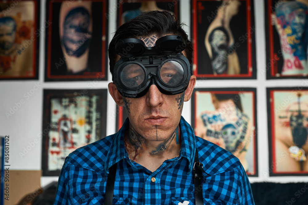 Portrait of tattooed man in welder glasses Portrait of tattooed man in welder glasses