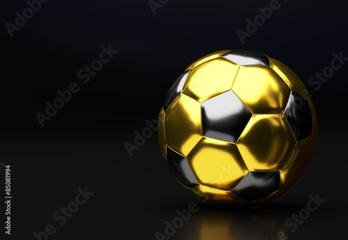 Golden soccer ball with reflection
