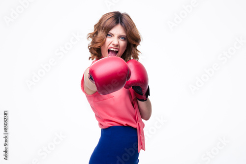 Angry elegant woman with boxing gloves fighting