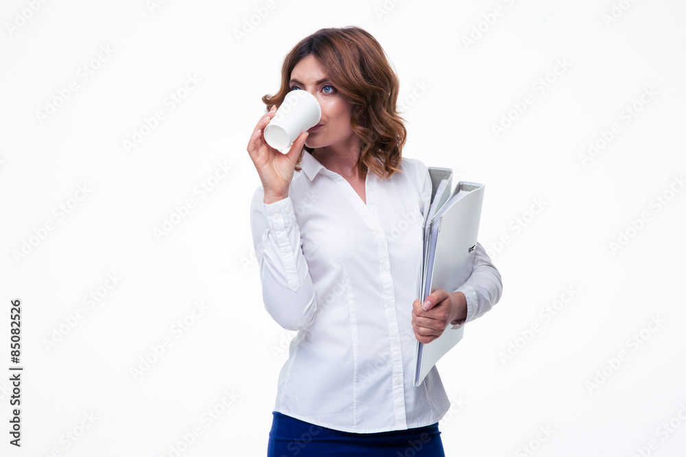 Businesswoman holding folders and drinking coffee isolated on a white background Businesswoman holding folders and drinking coffee isolated on a white background