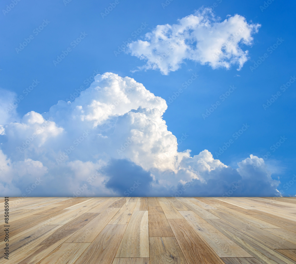 Empty wooden table with cloud and blue sky backgrounds. Blank space for put the produce or copy text