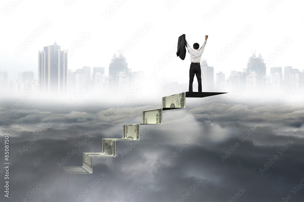 Man cheering on top of money stairs cityscape cloudscape Man cheering on top of money stairs cityscape cloudscape