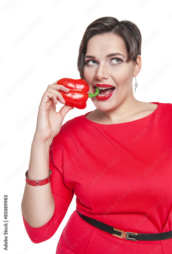 Beautiful plus size woman with red pepper isolated Beautiful plus size woman with red pepper isolated