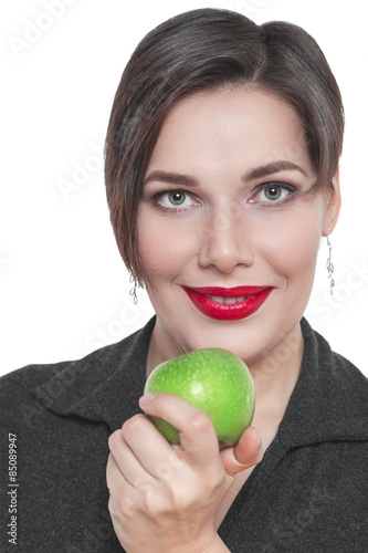 Beautiful plus size woman with green apple isolated