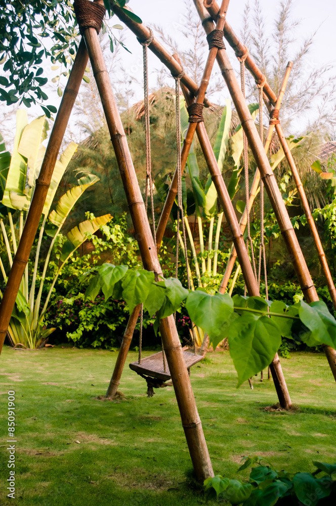 Fototapeta premium Bamboo swings in tropical garden
