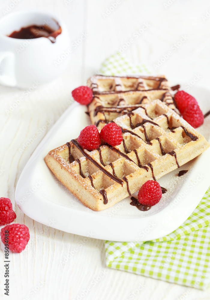 Belgium whole wheat waffles with raspberries and chocolate decor Belgium whole wheat waffles with raspberries and chocolate decor