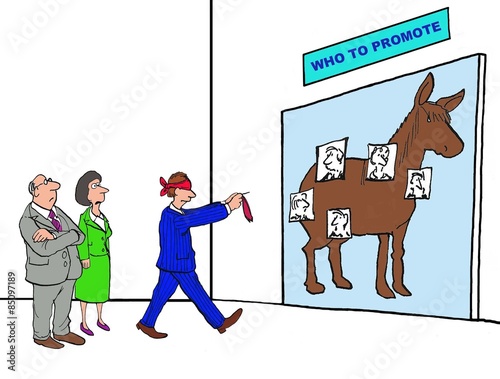 Business cartoon of blindfolded businessman playing the pin the tail on the donkey game, only it has been changed to 'who to promote'. photo