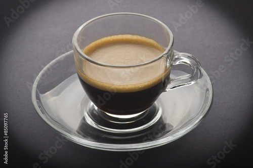 Cup of coffee on the black background