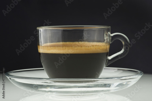 Cup of coffee on the black background