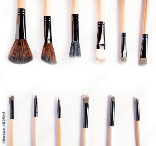 Makeup brushes on white background, top view