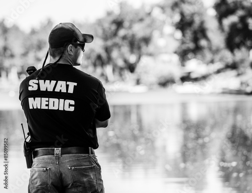 Quadro em tela SWAT Medic on Duty and on a Call in Black & White Photo