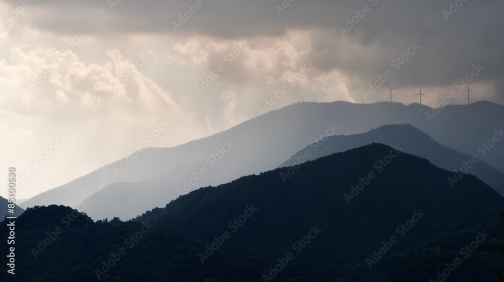 Storm over the wind farm, turbines. Lunigiana, Italy.