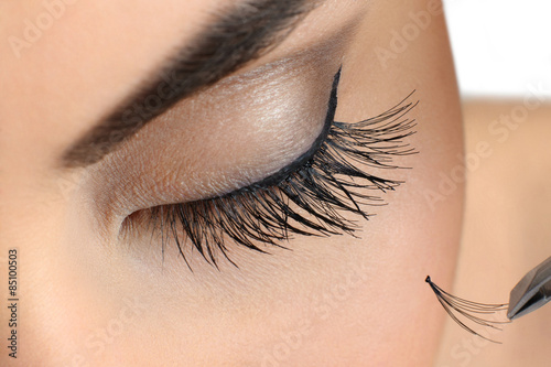Canvas Print Makeup close-up. Eyebrow makeup. Eyelash extension.
