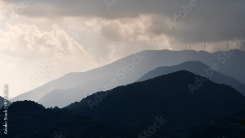 Storm over the wind farm, turbines. Lunigiana, Italy.