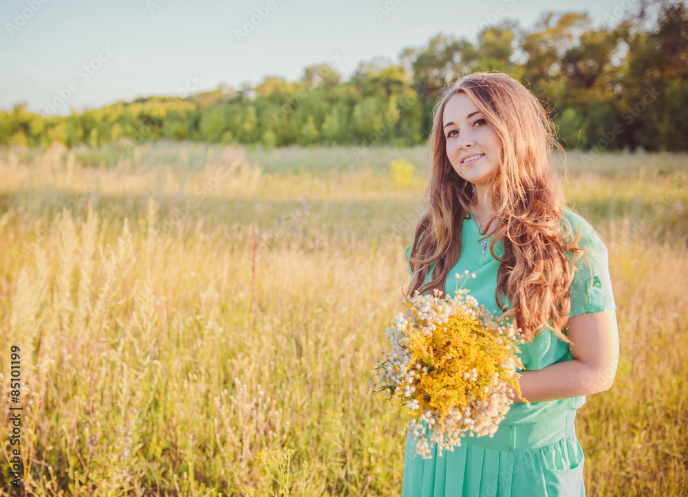 Artistic portrait of young gorgeous brunette on green meadow. Artistic portrait of young gorgeous brunette on green meadow.