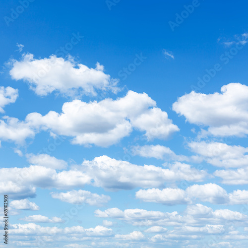 many little white clouds in summer blue sky