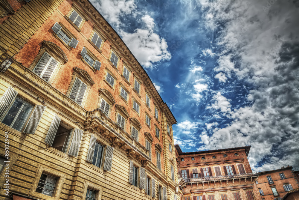 Chigi-Zondadari Palace under a cloudy sky