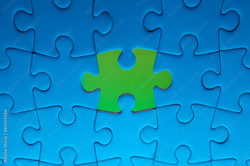 Missing jigsaw puzzle piece with light glow