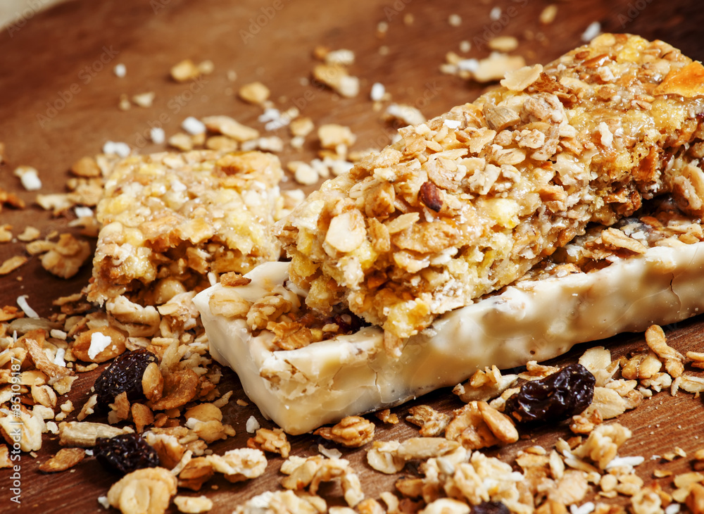 Bar muesli and spilled cereal, selective focus Bar muesli and spilled cereal, selective focus