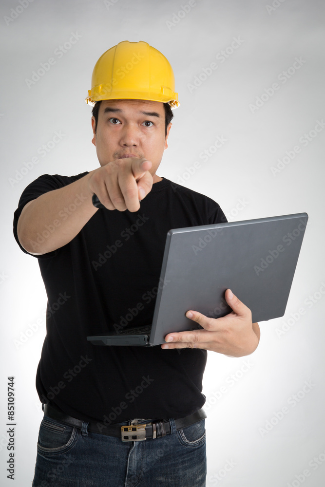 Engineer checking on production on laptop Engineer checking on production on laptop