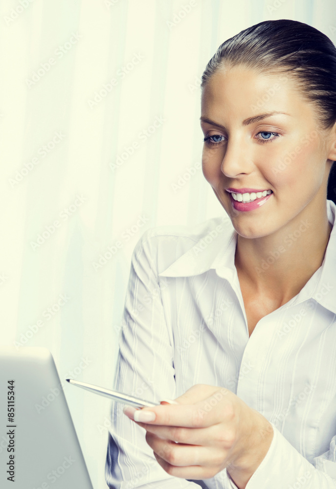 brunette businesswoman using laptop at office brunette businesswoman using laptop at office