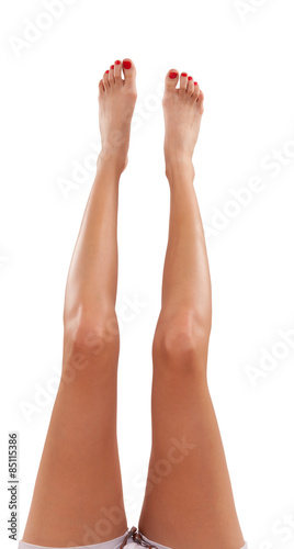 Slim female legs, isolated on white background