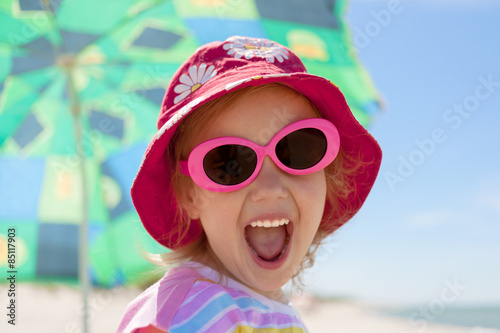 child girl happy smile healthy teeth sun glasses beach summer vacations