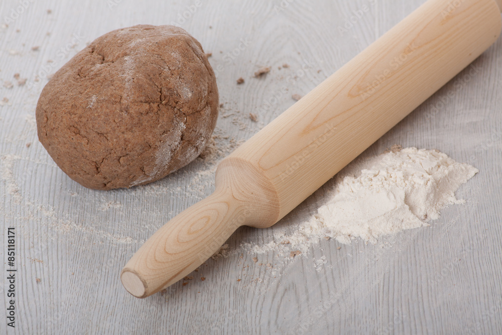 Dough with rolling pin on the table. Dough with rolling pin on the table.