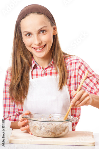 young woman knead the dough