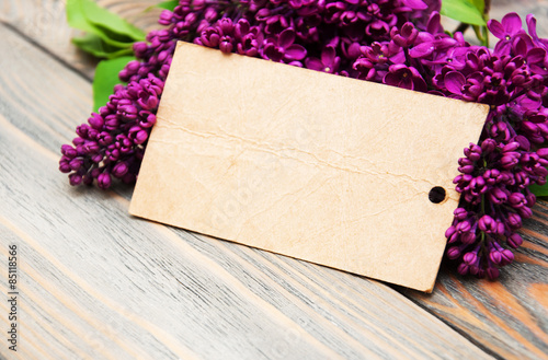 Lilac flowers with empty tag