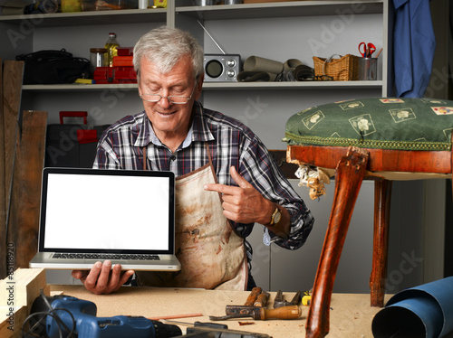 Retired carpenter with laptop