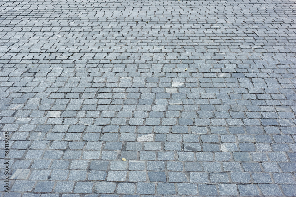 Background of sett. Cobblestone pavement. Texture.