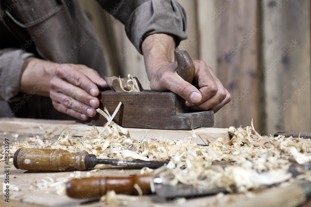 hands of carpenter plane on the workbench in carpentry hands of carpenter plane on the workbench in carpentry