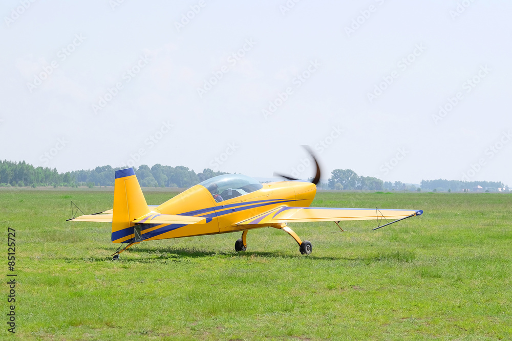 The image of a sport propeller airplane The image of a sport propeller airplane