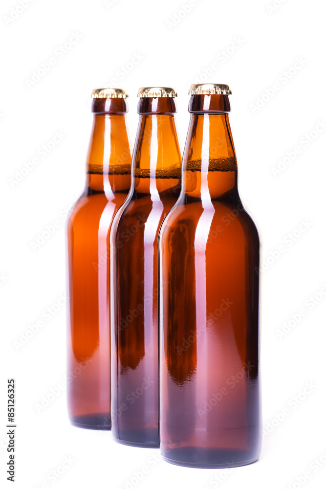 Three bottles of ice cold beer isolated on white Three bottles of ice cold beer isolated on white