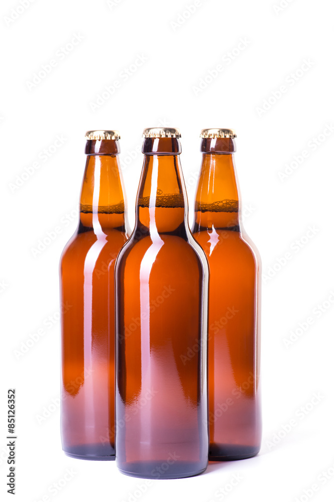 Three bottles of ice cold beer isolated on white Three bottles of ice cold beer isolated on white