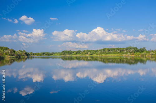 Calm beautiful rural landscape with a lake 