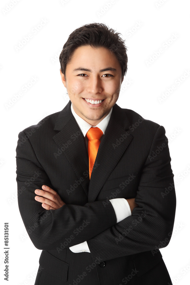 businessman in his 20s wearing a suit with an orange tie businessman in his 20s wearing a suit with an orange tie